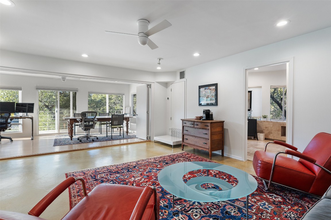 2102 North Oak Canyon Road Austin, TX 78746 - Photo 24 of 40 a living room with furniture and a table