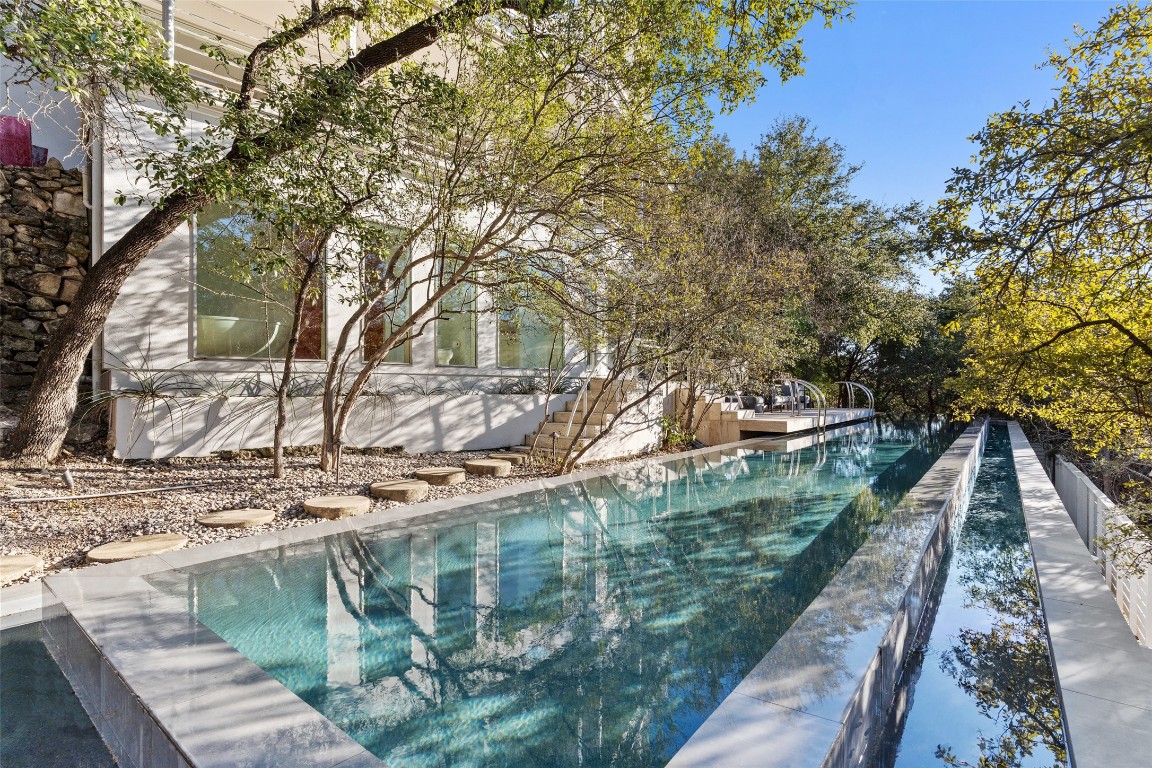 2102 North Oak Canyon Road Austin, TX 78746 - Photo 33 of 40 a view of a wooden deck and trees