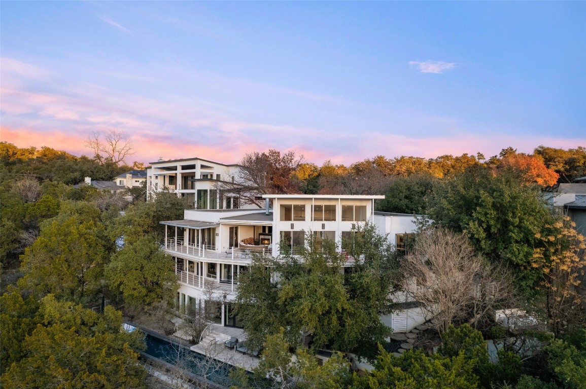 2102 North Oak Canyon Road Austin, TX 78746 - Photo 37 of 40 a view of a house with a yard and balcony