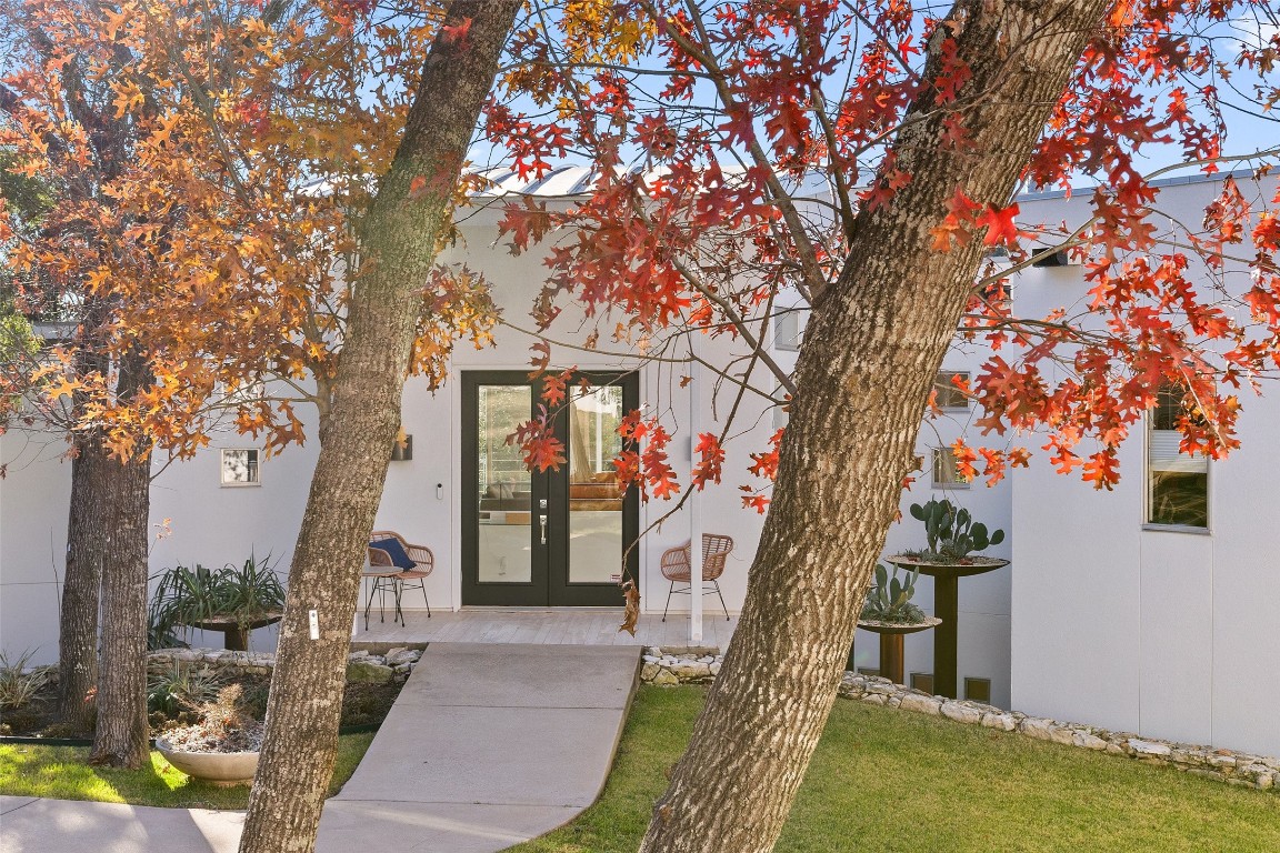 2102 North Oak Canyon Road Austin, TX 78746 - Photo 5 of 40 a front view of a house with garden