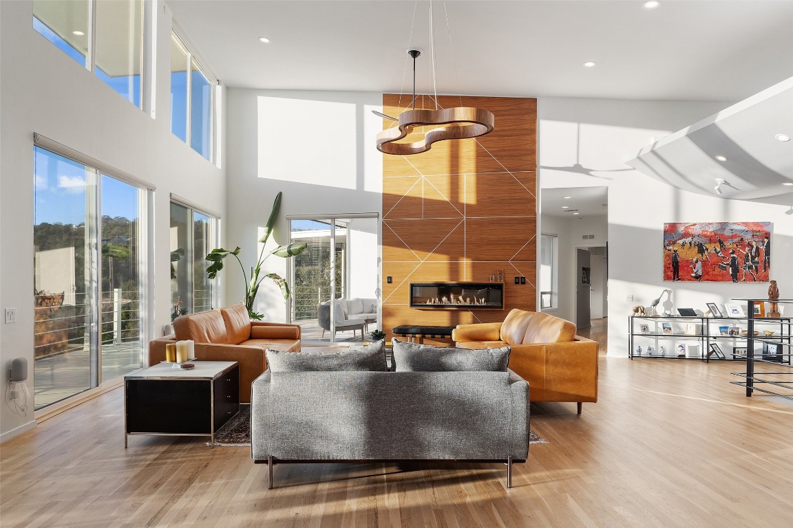 2102 North Oak Canyon Road Austin, TX 78746 - Photo 6 of 40 a living room with furniture and a large window