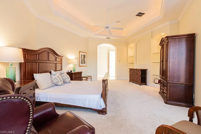 a bedroom with furniture and a fireplace