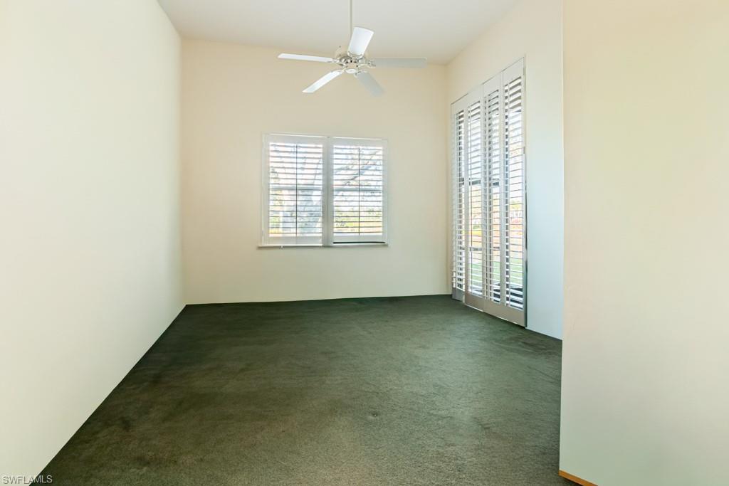 1676 Persimmon Drive Naples, FL 34109 - Photo 37 of 50 an empty room with windows