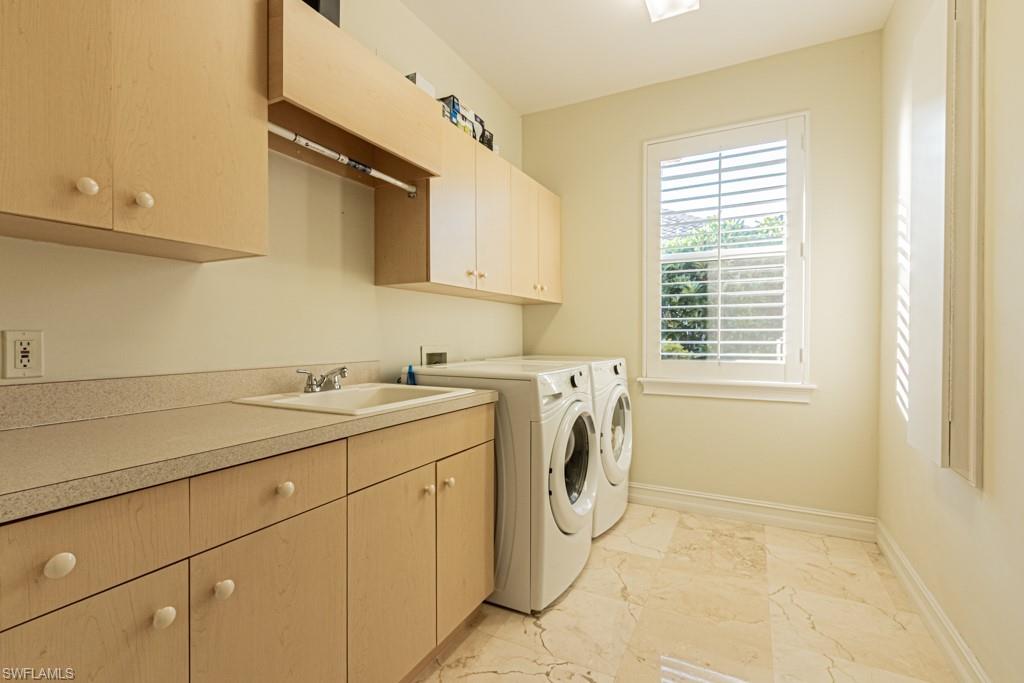 1676 Persimmon Drive Naples, FL 34109 - Photo 40 of 50 a utility room with dryer and washer