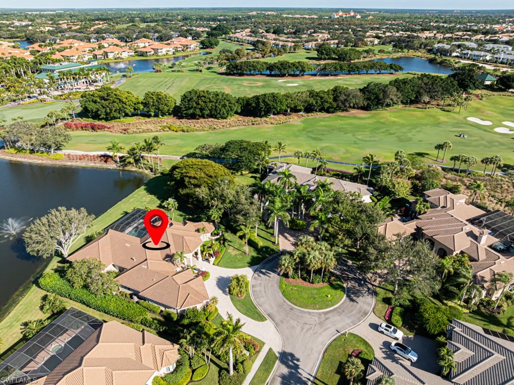1676 Persimmon Drive Naples, FL 34109 - Photo 42 of 50 an aerial view of a table and chairs and potted plants