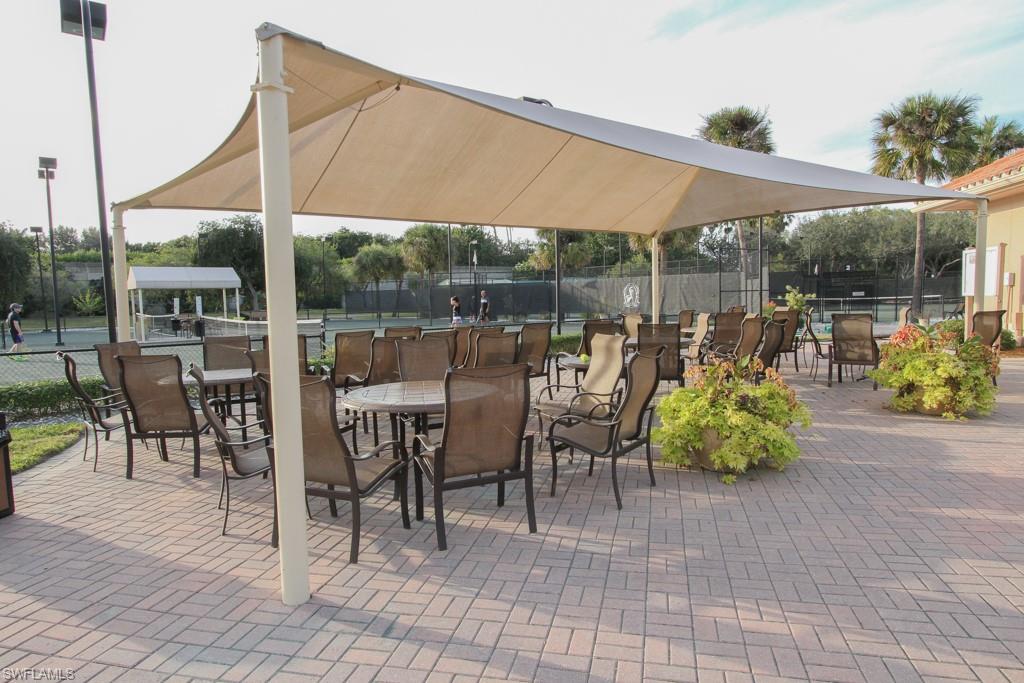 1676 Persimmon Drive Naples, FL 34109 - Photo 48 of 50 a outdoor view with a sitting space
