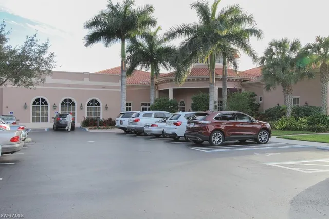 a car parked in front of a house and a car parked on the road
