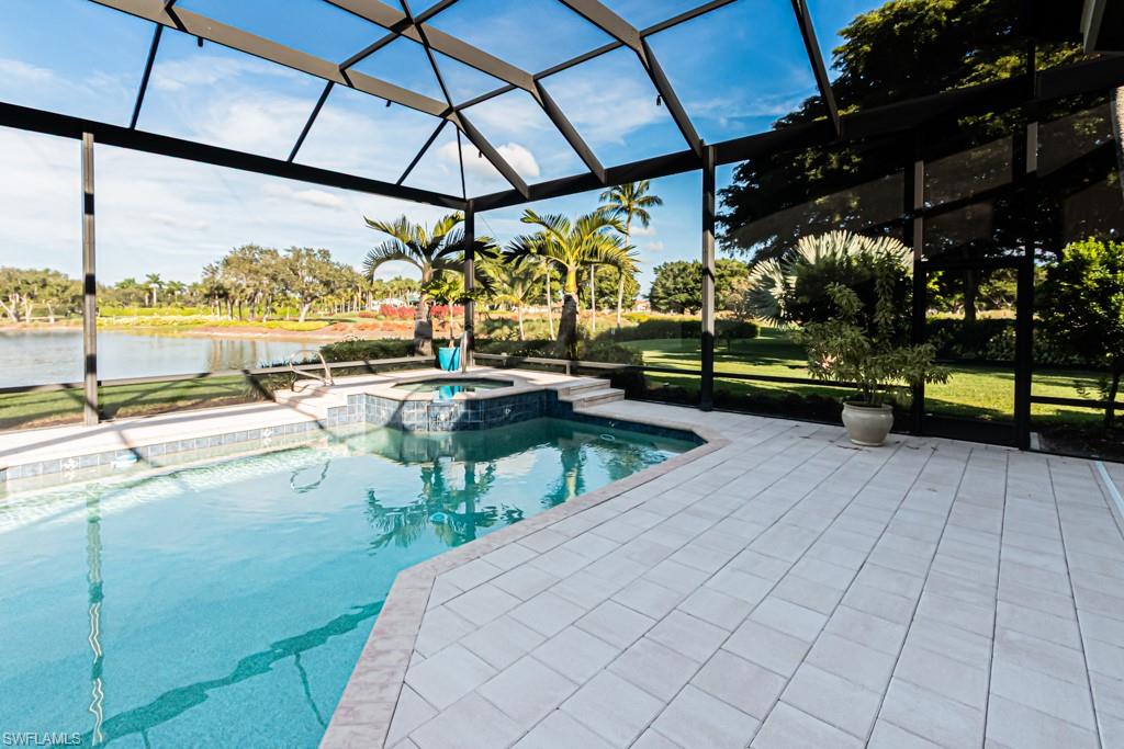 1676 Persimmon Drive Naples, FL 34109 - Photo 6 of 50 a view of swimming pool with outdoor seating