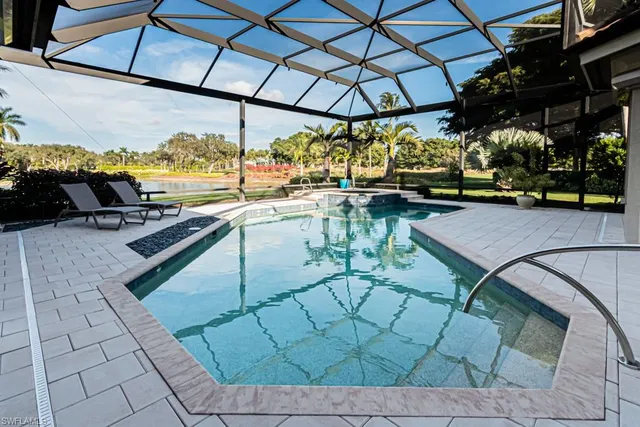 a view of a swimming pool with a patio