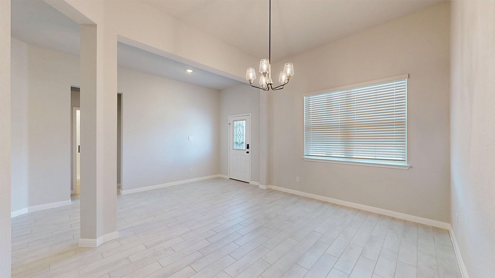 14537 Egon Road Salado, TX 76571 - Photo 1 of 27 Empty room featuring a chandelier and wood finish floors