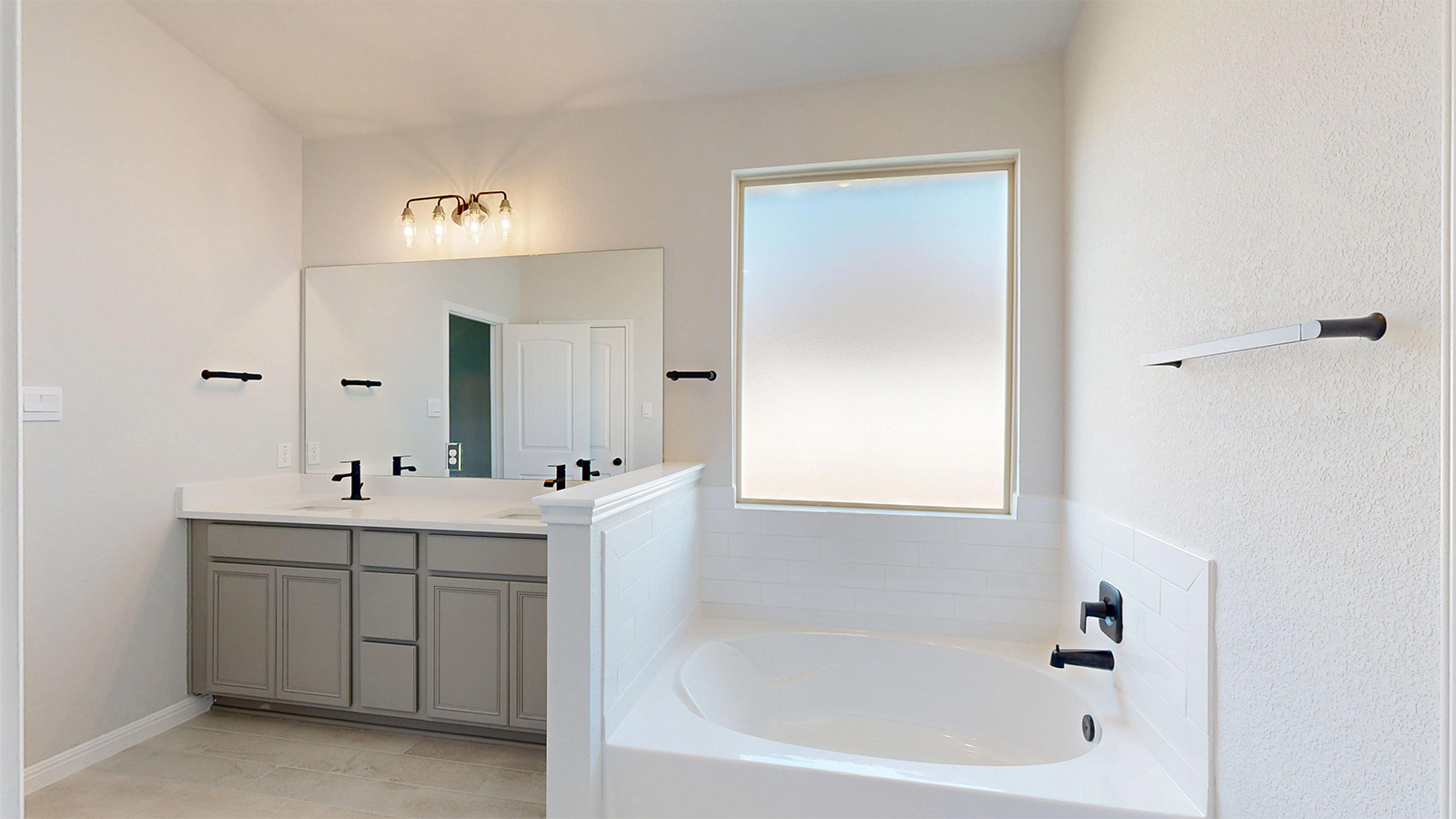 14537 Egon Road Salado, TX 76571 - Photo 12 of 27 Full bath with double vanity, a bath, and light tile patterned floors