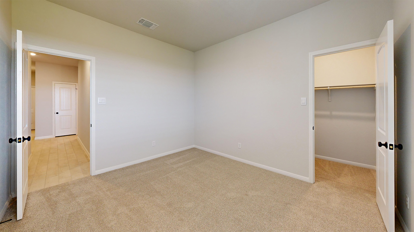 14537 Egon Road Salado, TX 76571 - Photo 18 of 27 Unfurnished bedroom featuring a walk in closet and light colored carpet