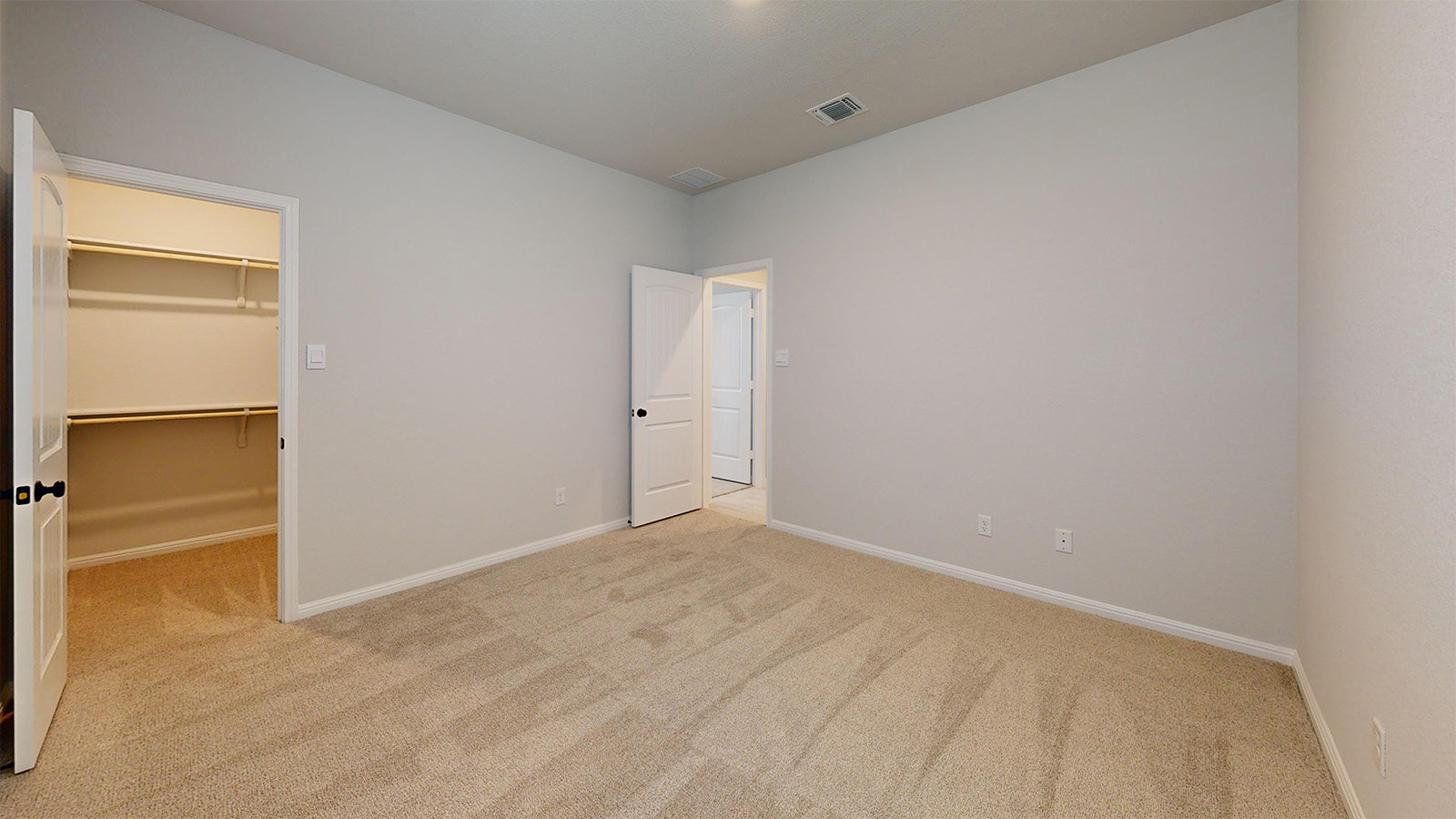 14537 Egon Road Salado, TX 76571 - Photo 22 of 27 Unfurnished bedroom with a walk in closet and light carpet