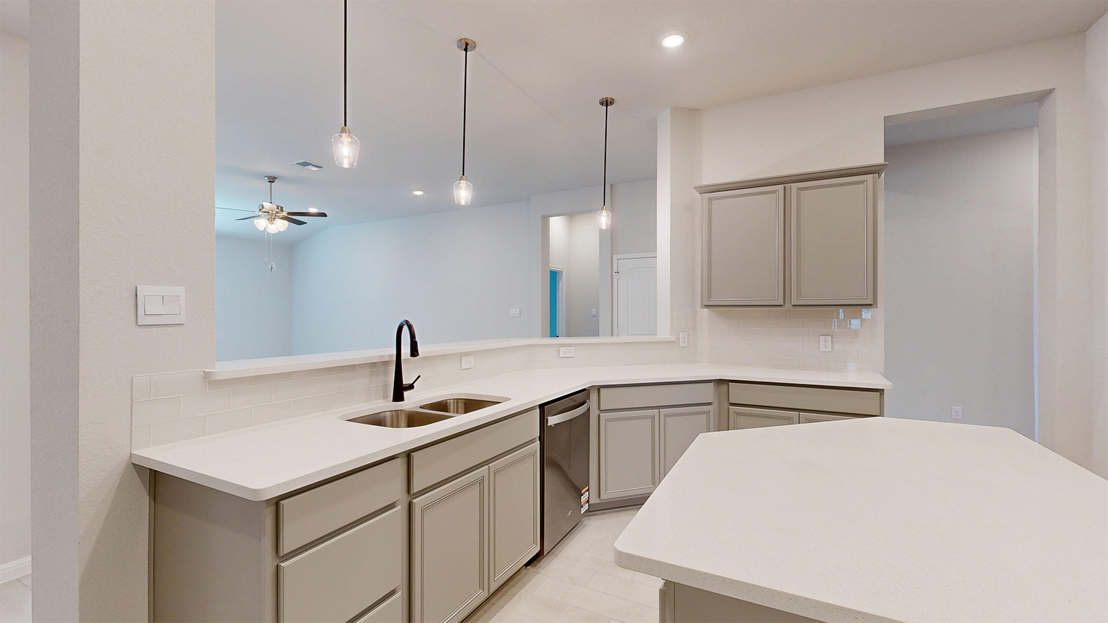 14537 Egon Road Salado, TX 76571 - Photo 5 of 27 Kitchen with gray cabinets, pendant lighting, ceiling fan, stainless steel dishwasher, and light stone countertops