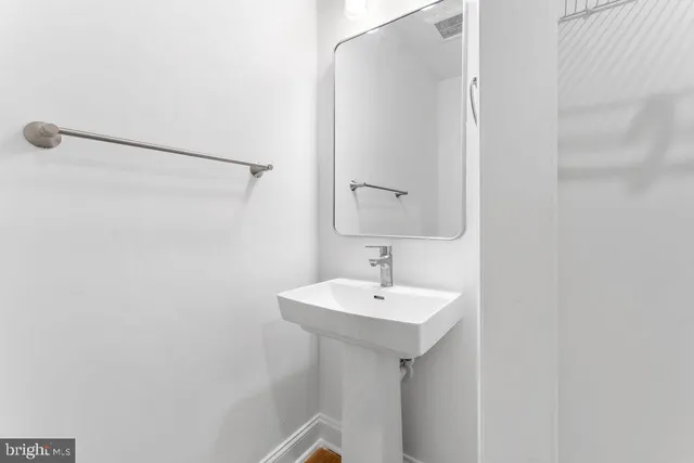 a bathroom with a toilet and a sink