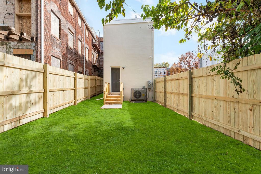 40 South Fulton Avenue Baltimore, MD 21223 - Photo 16 of 42 a view of backyard with large trees