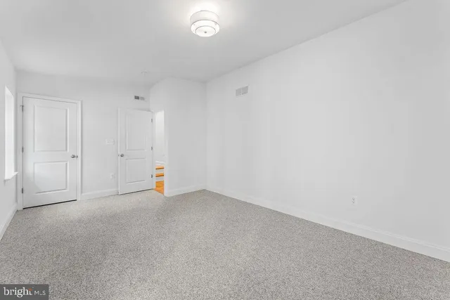 a bathroom with a toilet a sink and shower