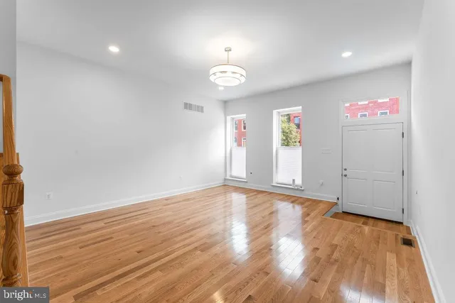 a view of kitchen with wooden floor and window