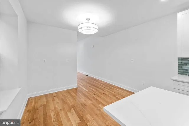 a kitchen with granite countertop a sink and steel appliances
