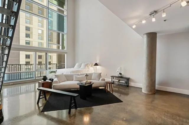 a living room with furniture and a table
