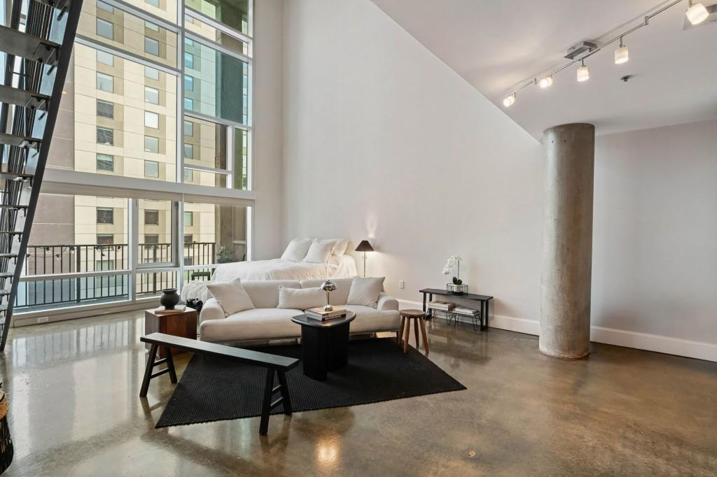a living room with furniture and a table