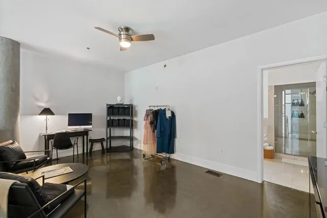 a view of a livingroom with furniture and a flat screen tv