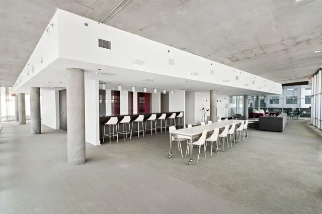 a dining room with furniture and a ceiling fan