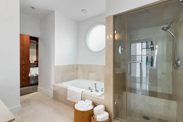 a bathroom with a bathtub shower sink and toilet