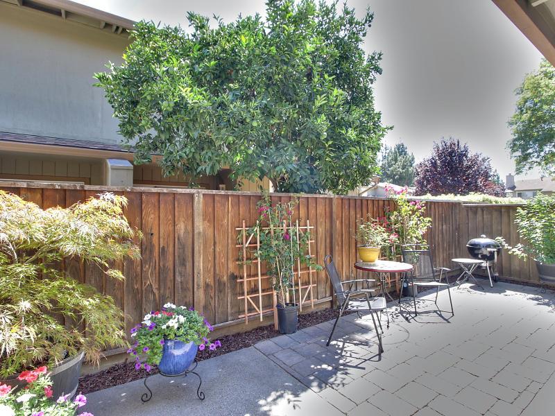 104 Rose Lane San Jose, CA 95127 - Photo 17 of 19 a garden with flowers and a table