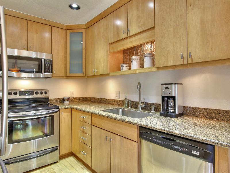 104 Rose Lane San Jose, CA 95127 - Photo 8 of 19 a kitchen with granite countertop a sink stainless steel appliances and cabinets