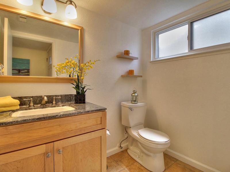 104 Rose Lane San Jose, CA 95127 - Photo 10 of 19 a bathroom with a sink a toilet and mirror