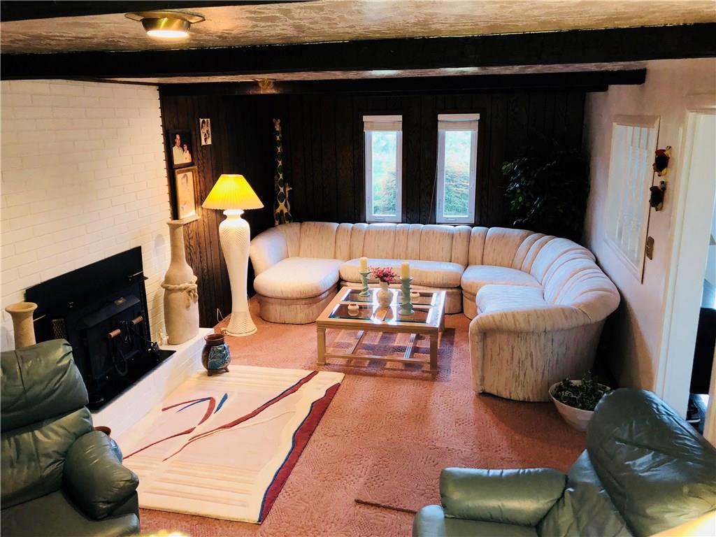 3131 Guffey Road North Huntingdon, PA 15642 - Photo 22 of 25 Main level gameroom/family room w/woodburner