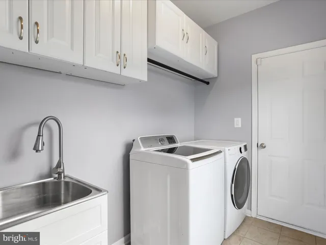 a view of storage and utility room with washer and dryer