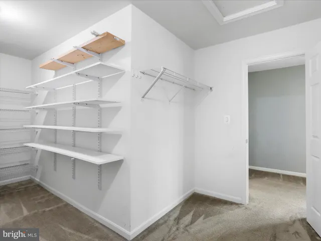 a view of an empty walk in closet