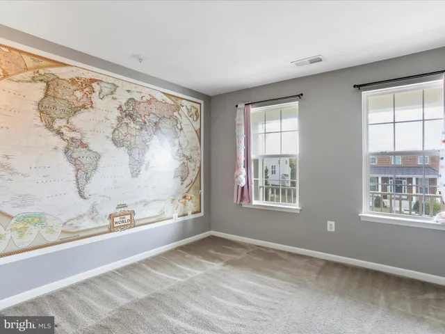 a view of a bedroom with a large window and bed