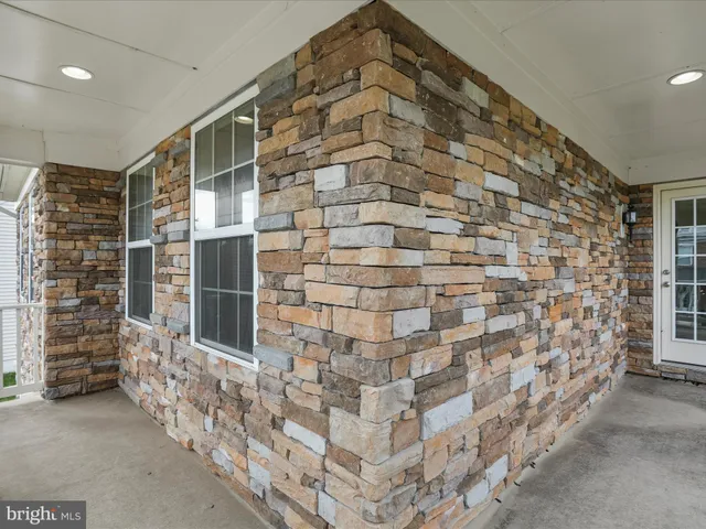 a bathroom with a shower and a sink