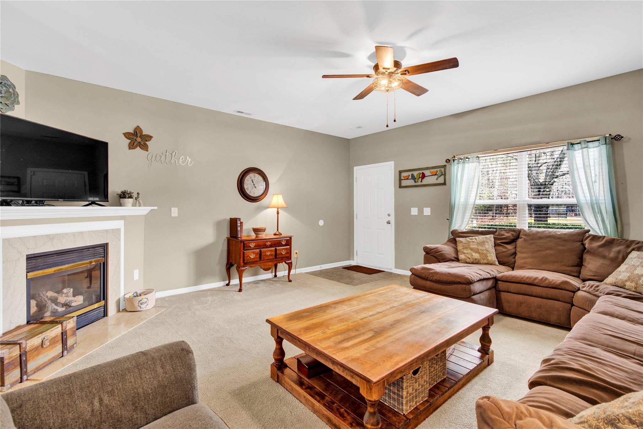 115 South Ranney Way Mooresville, NC 28117 - Photo 8 of 38 a living room with furniture and a fireplace