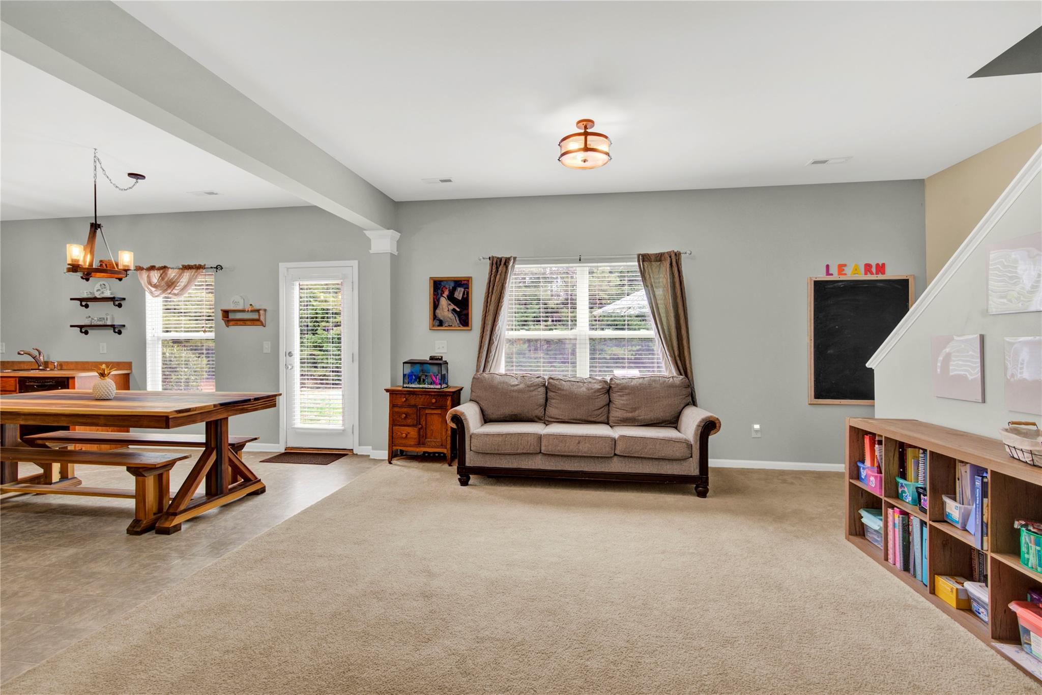 115 South Ranney Way Mooresville, NC 28117 - Photo 10 of 38 a living room with furniture and a flat screen tv