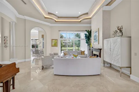 a kitchen with a stove a sink dishwasher and a fireplace with wooden floor