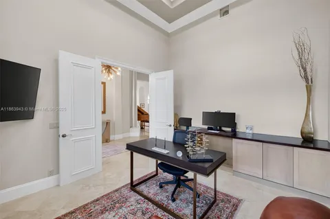 an aerial view of residential houses with outdoor space and trees