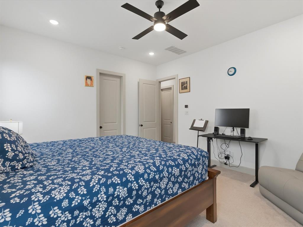 9533 Keep Street Frisco, TX 75035 - Photo 18 of 40 Recessed lighting illuminates this room featuring light-toned carpeting and a ceiling fan