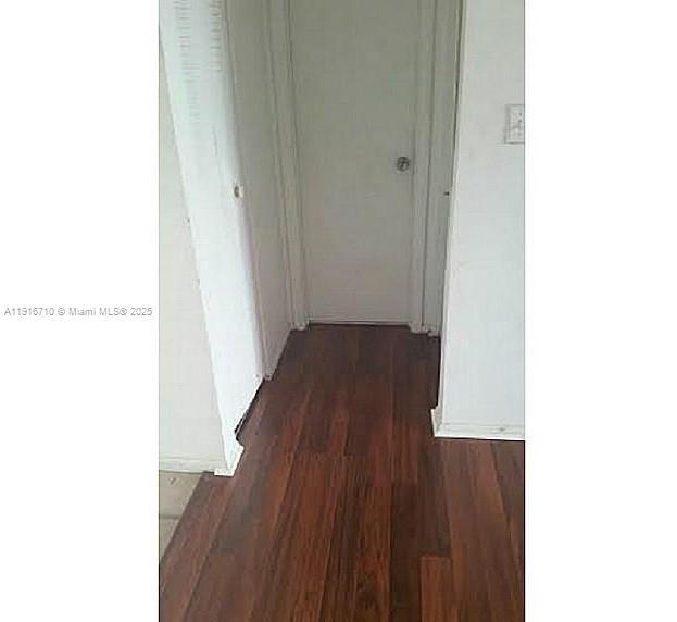 19825 Southwest 114th Avenue, Unit 323 Miami, FL 33157 - Photo 11 of 22 a view of a hallway with wooden floor