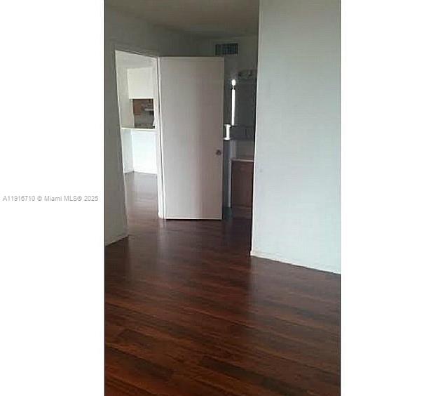 19825 Southwest 114th Avenue, Unit 323 Miami, FL 33157 - Photo 16 of 22 a view of a hallway with wooden floor