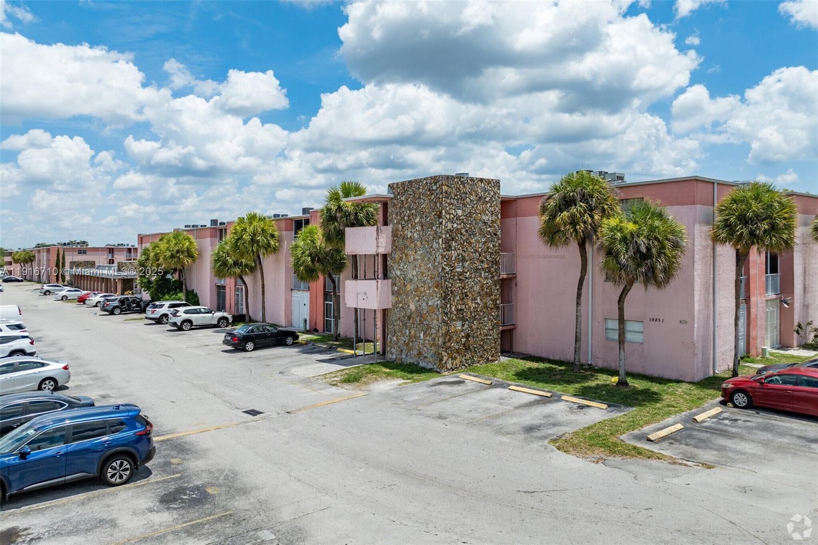 19825 Southwest 114th Avenue, Unit 323 Miami, FL 33157 - Photo 2 of 22 a row of cars parked in front of a house