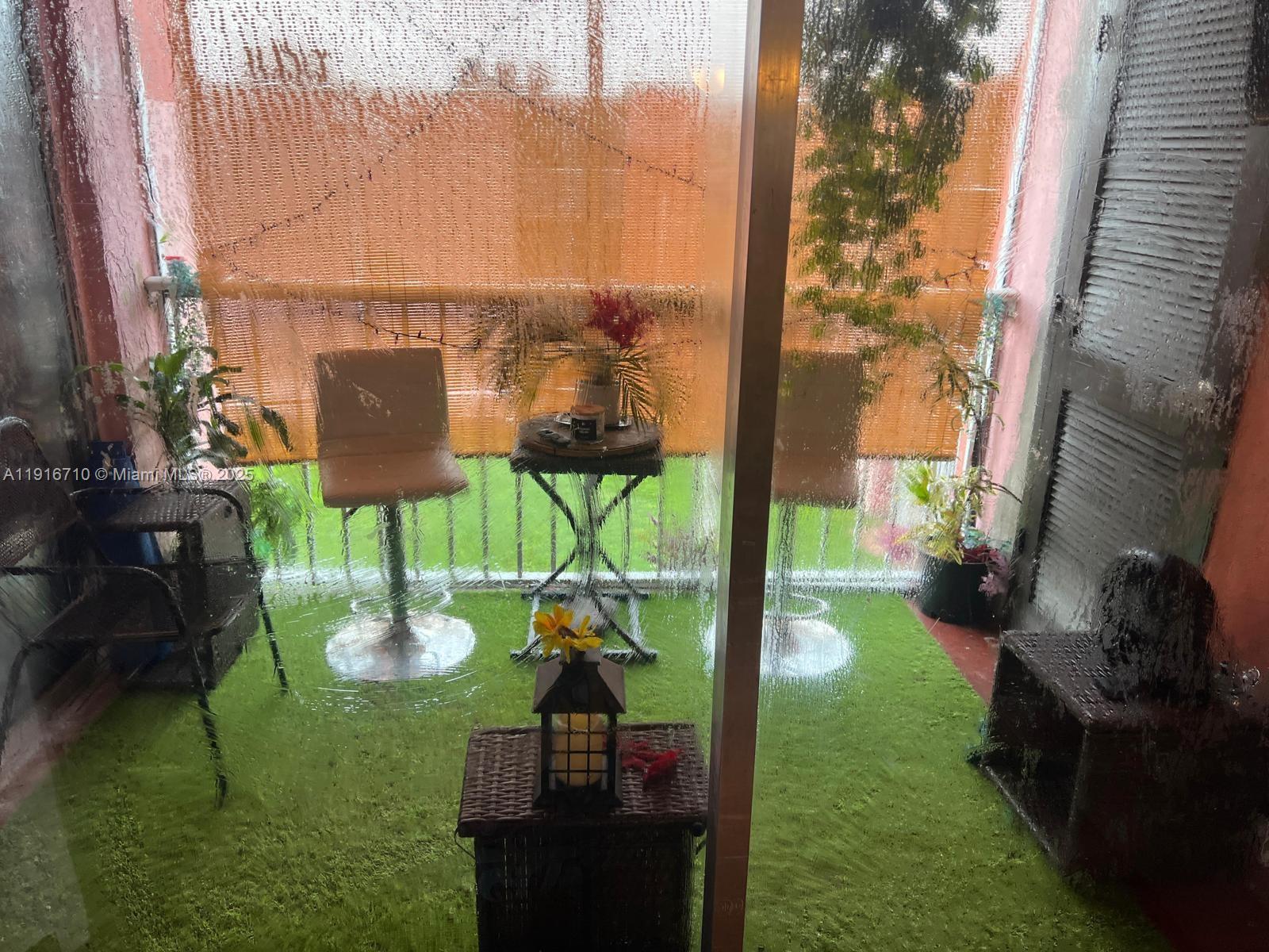 19825 Southwest 114th Avenue, Unit 323 Miami, FL 33157 - Photo 5 of 22 a backyard of a house with lots of green space and seating area