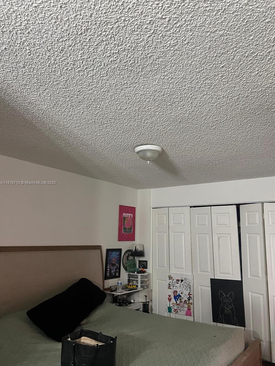 19825 Southwest 114th Avenue, Unit 323 Miami, FL 33157 - Photo 8 of 22 a view of a room with gym equipment