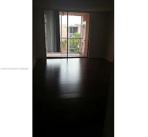a kitchen with granite countertop a sink stove and cabinets
