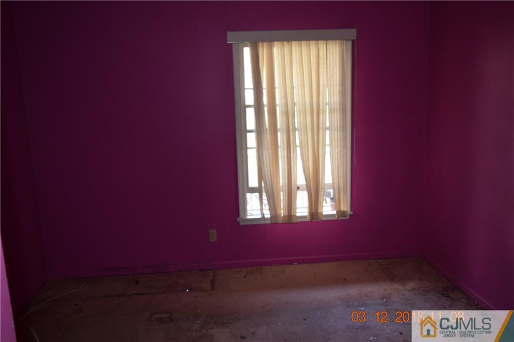 205 Commons Way, Unit 5 East Brunswick, NJ 08816 - Photo 6 of 10 an empty room with a window