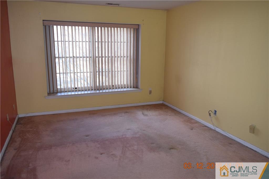 205 Commons Way, Unit 5 East Brunswick, NJ 08816 - Photo 7 of 10 an empty room with a window