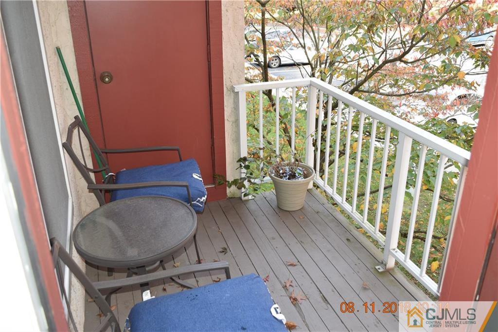 205 Commons Way, Unit 5 East Brunswick, NJ 08816 - Photo 9 of 10 a view of a balcony with furniture